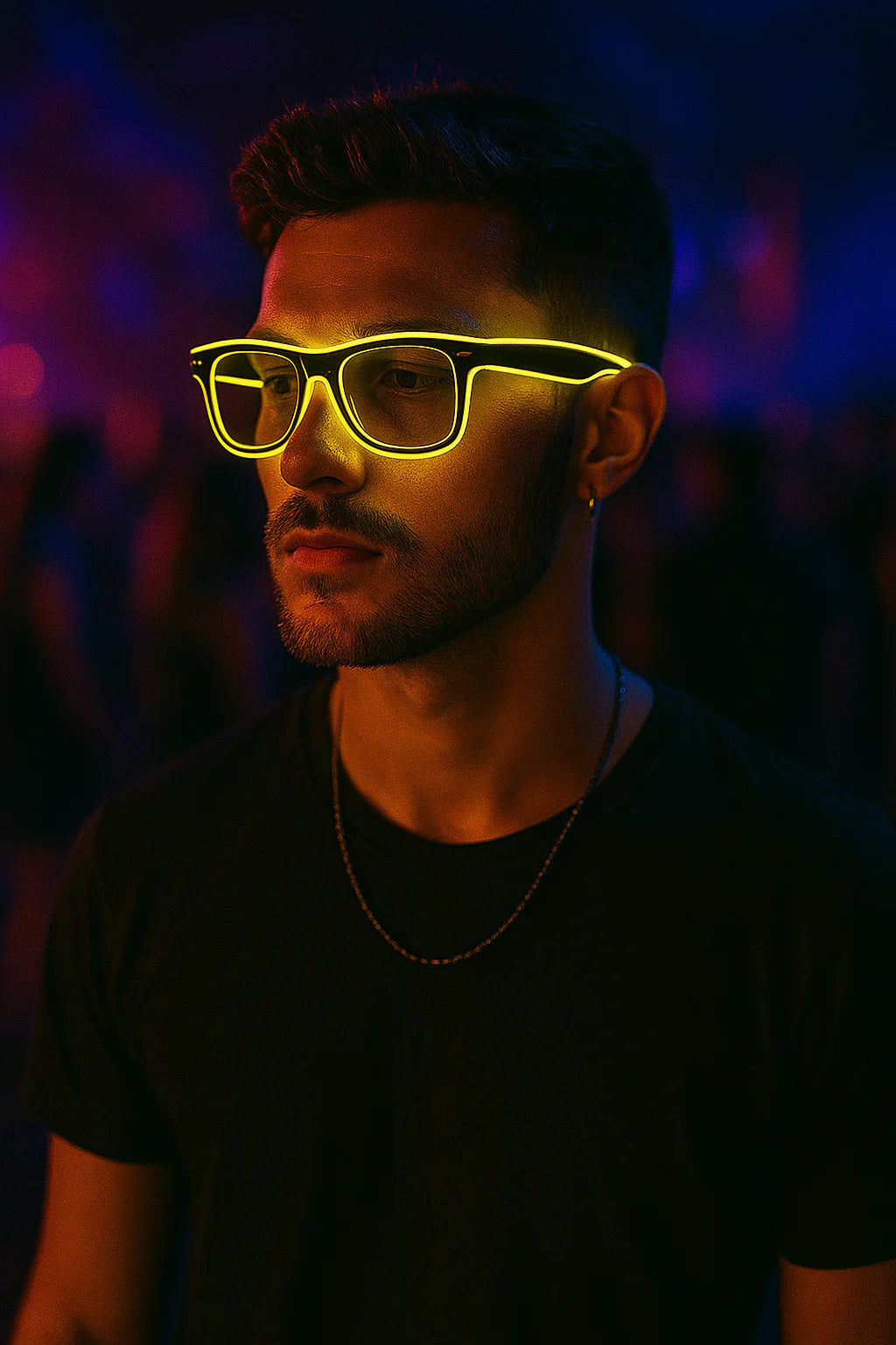 Man wearing neon yellow glasses in a dark setting