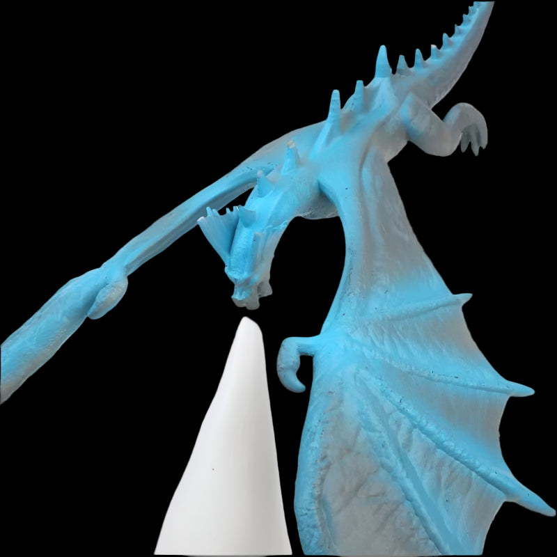Blue dragon figurine on a white background