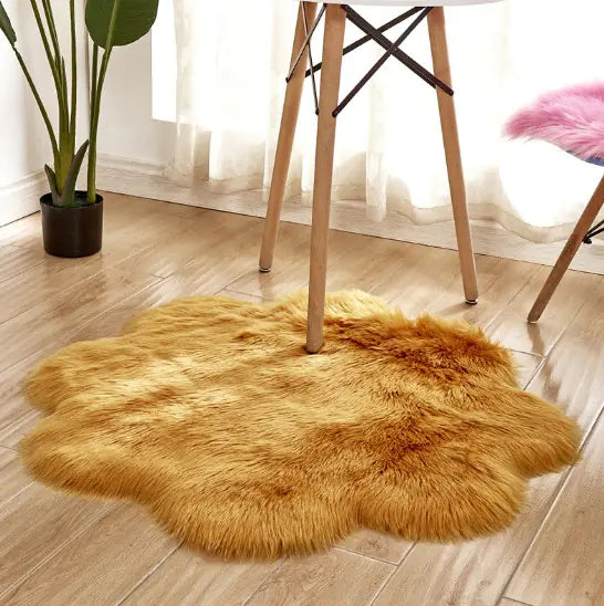 Fluffy gold rug on a wooden floor with a chair and plant in the background