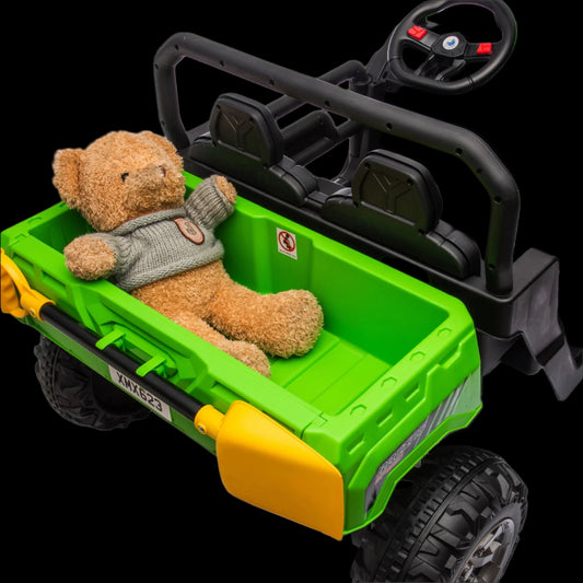 Toy green and black vehicle with a teddy bear in the bed on a white background