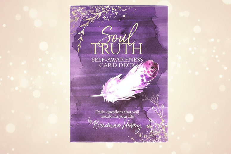 Purple card deck cover with feather illustration and text 'Soul Truth Self-Awareness Card Deck' on a white background