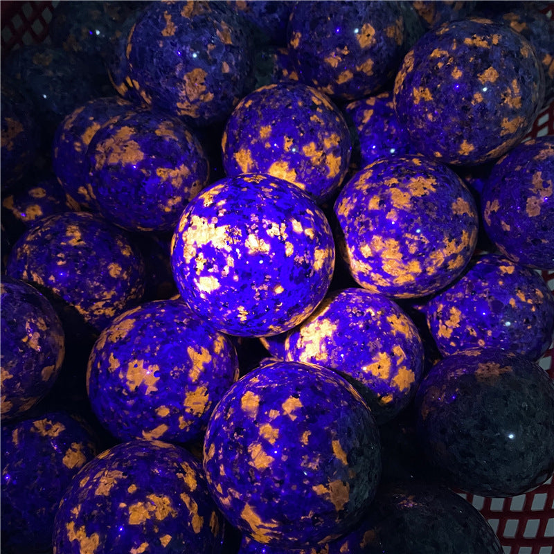 Blue and gold marbled balls stacked together