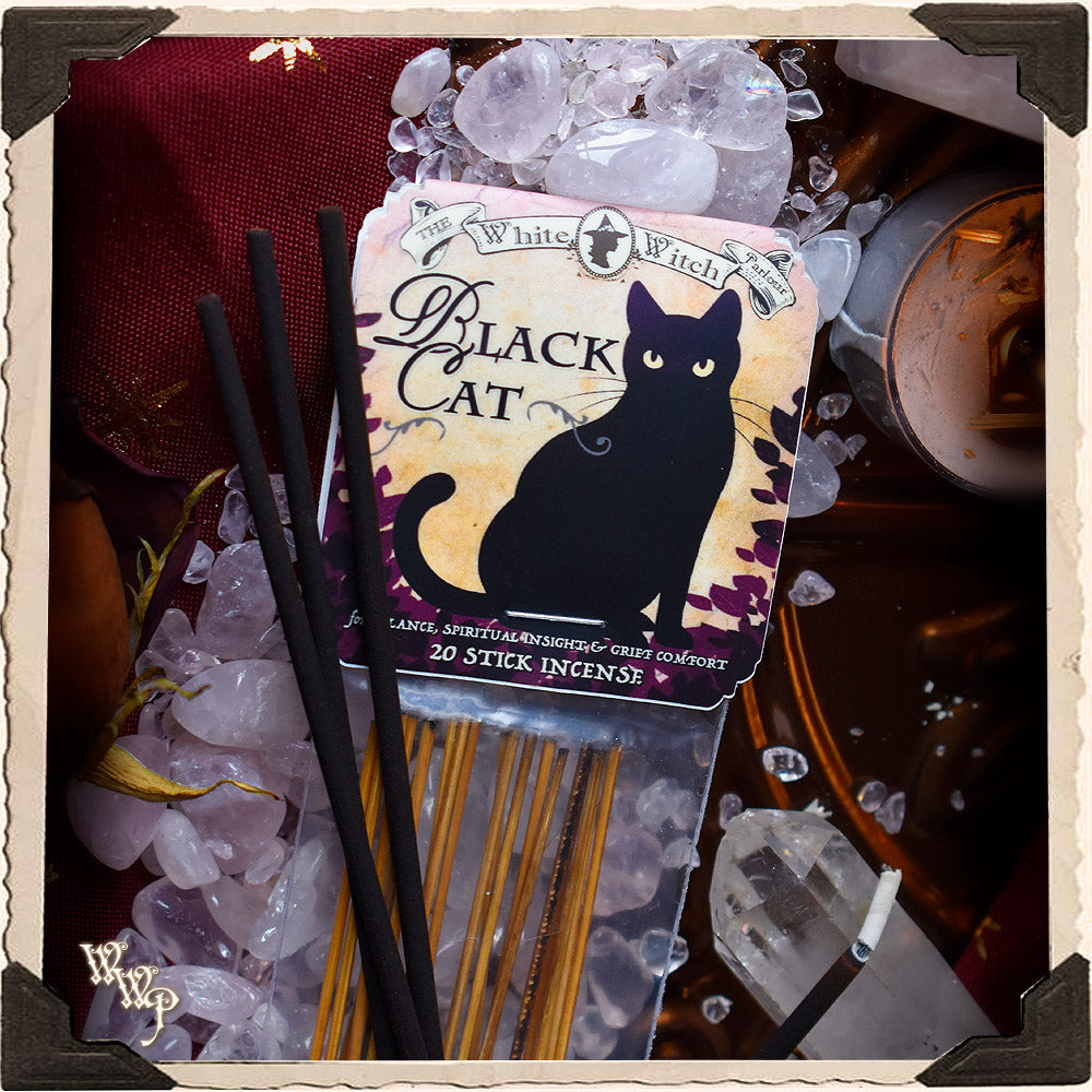 Black Cat incense sticks packaging with decorative background