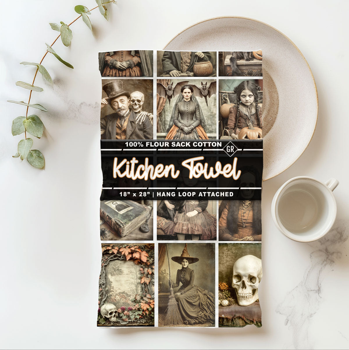 Kitchen towel packaging with vintage-style images on a marble surface with a cup and plant.