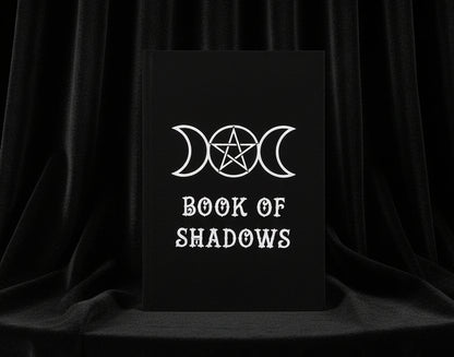 Black book cover with white 'Book of Shadows' text and triple moon symbol on a white background