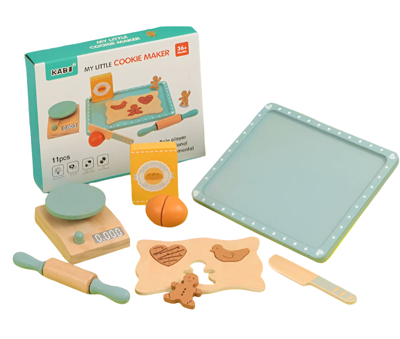 Children's cookie baking set with toy oven, tray, and gingerbread man on a yellow surface.