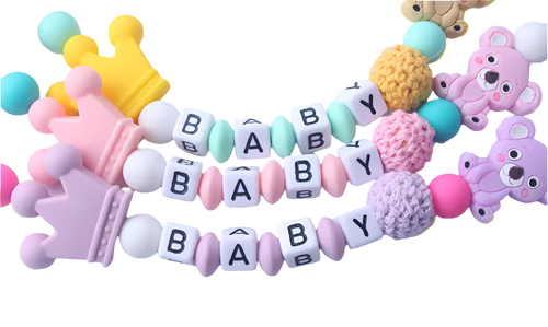 Colorful baby teething necklace with letters spelling 'BABY' on a white background