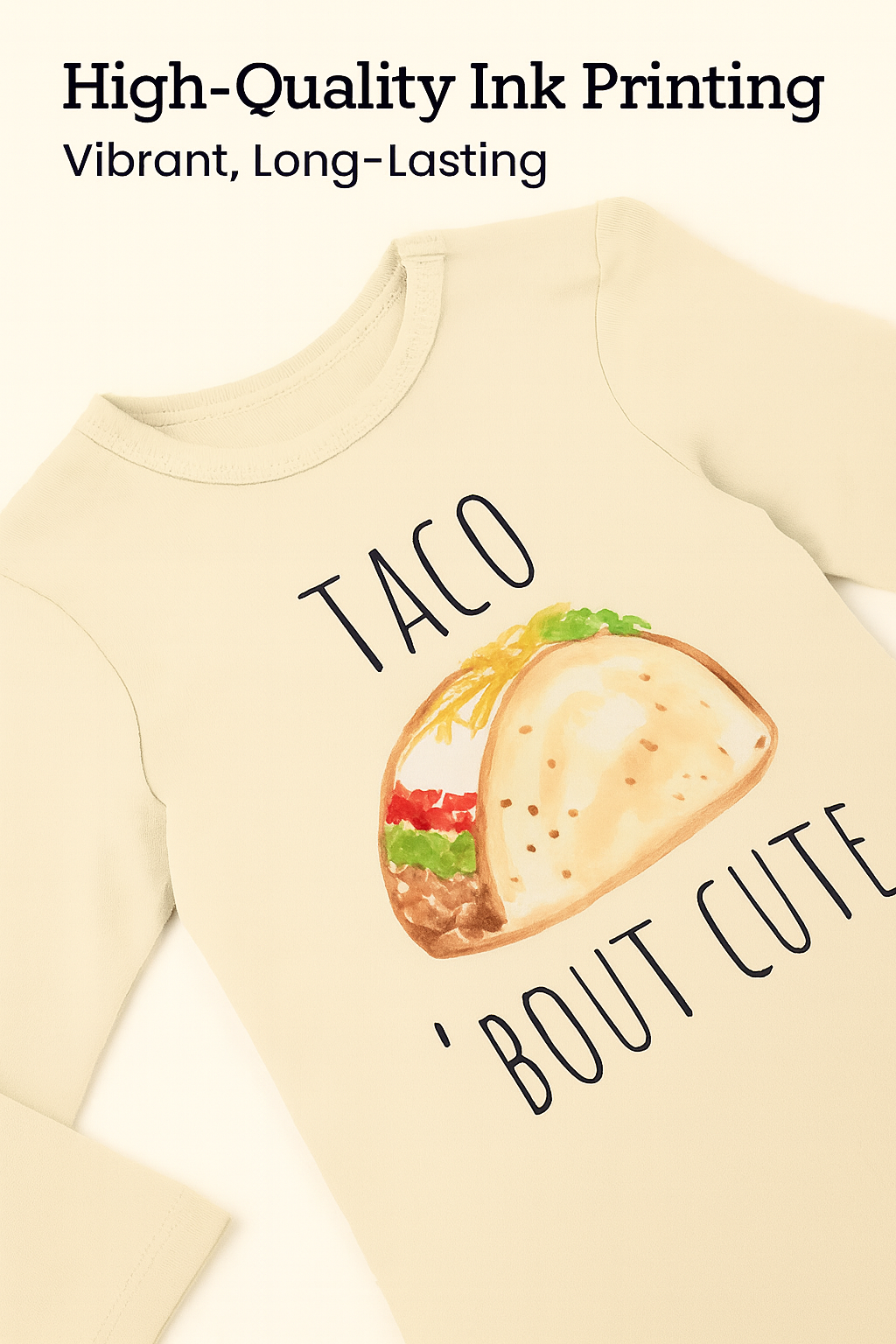 Beige sweatshirt with a taco graphic and text 'TACO 'BOUT CUTE' on a white background.