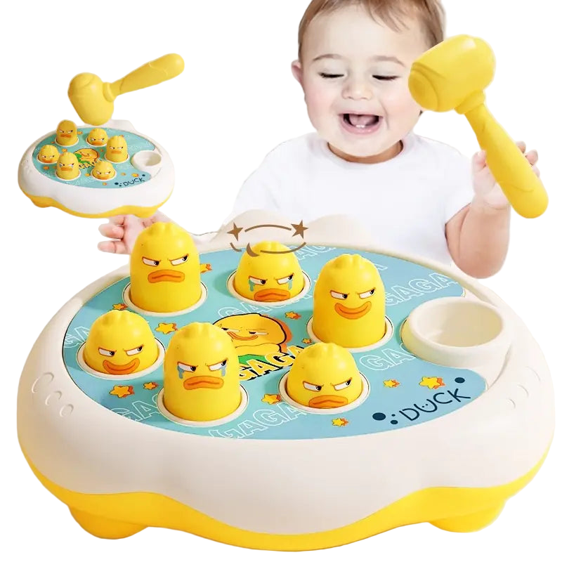Child playing with a rubber duck toy set and mallet on a light background