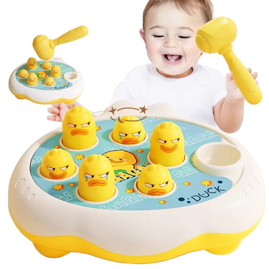 Child playing with a rubber duck toy set and mallet on a light background