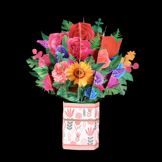 Colorful 3D paper flower bouquet in a decorative pot on a pink background