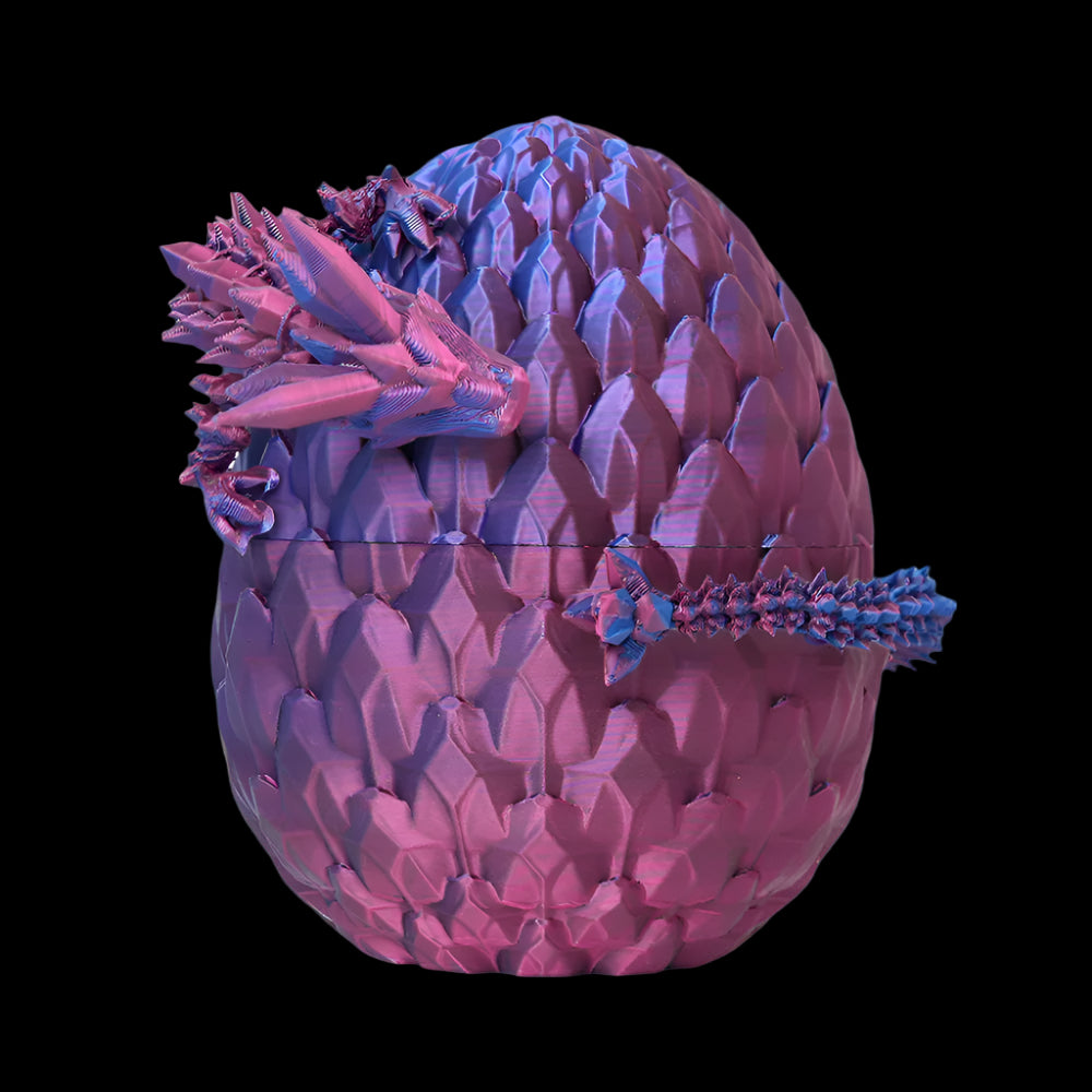 Purple and blue dragon egg with spiky texture on a white background