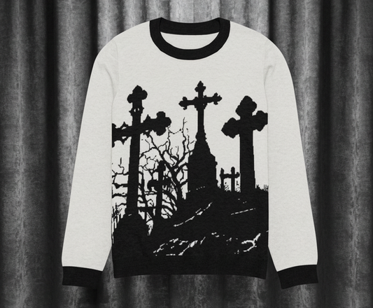 Sweater with black silhouette design of a cemetery on a white background