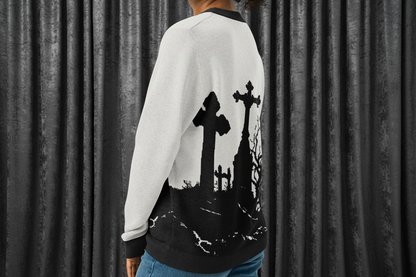 Person wearing a black and white sweater with cemetery design on a transparent background
