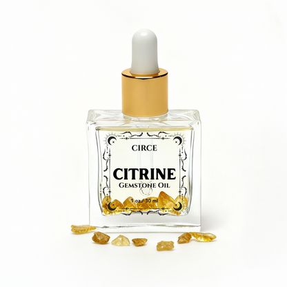 Circe Citrine Gemstone Oil bottle with gold cap on a white background