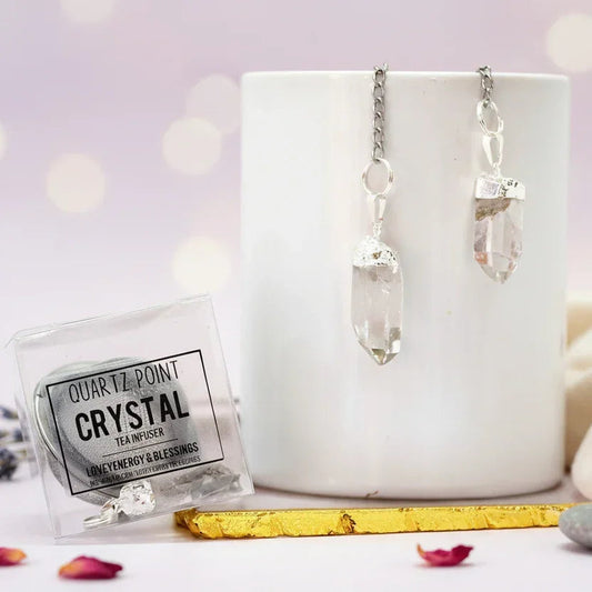 Crystal point tea infuser with packaging on a white surface with a blurred background