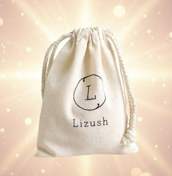 Beige drawstring bag with 'Lizush' branding on a light gray background