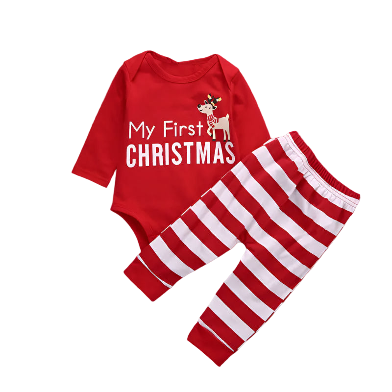 Red baby onesie with 'My First Christmas' text and red and white striped pants on a wooden surface.