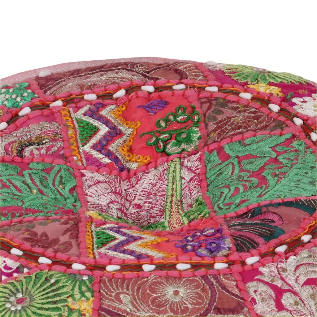 Colorful embroidered fabric with intricate patterns on a white background