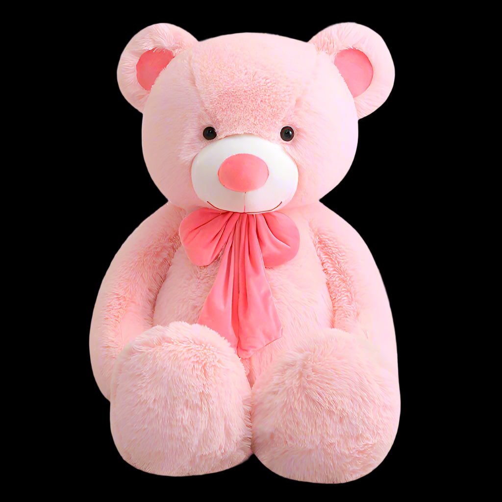 Pink teddy bear with a bow on a white background
