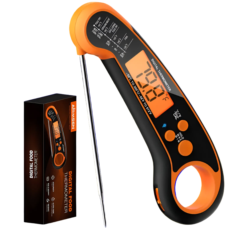 Digital food thermometer with orange and black design, displayed with its packaging on a white background.