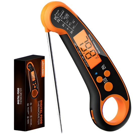 Digital food thermometer with orange and black design, displayed with its packaging on a white background.