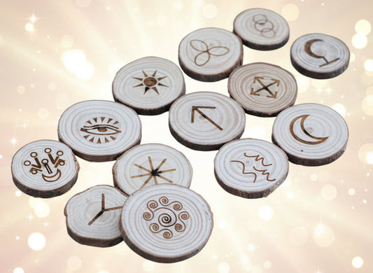 Wooden discs with engraved symbols on a dark background