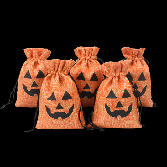 Set of five orange drawstring bags with black jack-o'-lantern faces on a white background