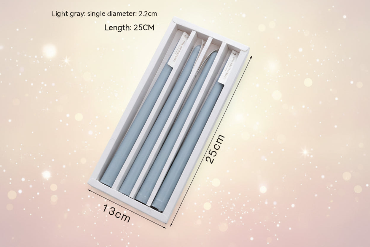 Light gray candles in a box with measurements on a white background