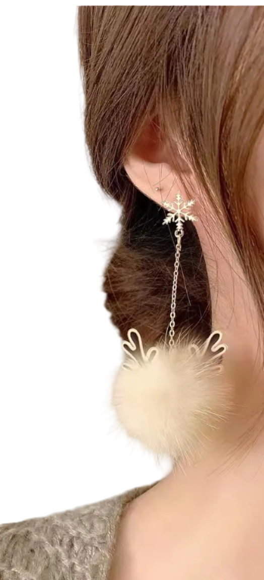 Close-up of a person wearing a fluffy earring with a neutral background
