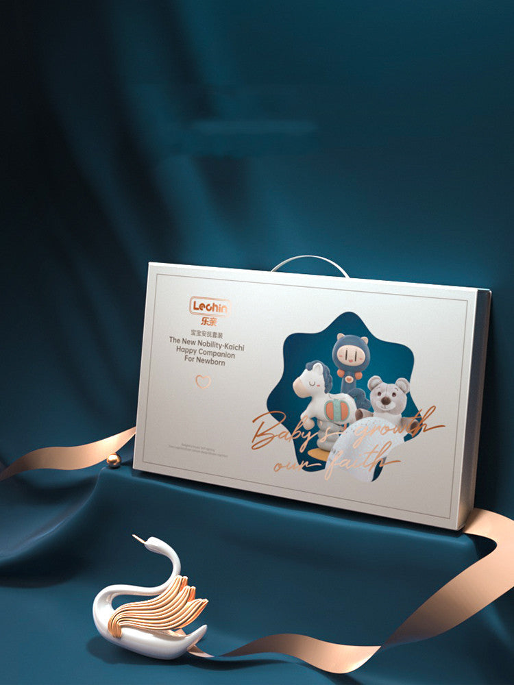Gift box with baby products on a dark blue background