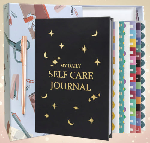 Black self-care journal with gold text and colorful pages on a white background