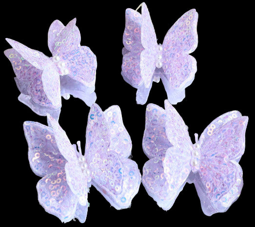 Purple butterfly decorations on a decorative mirror with a gold frame.