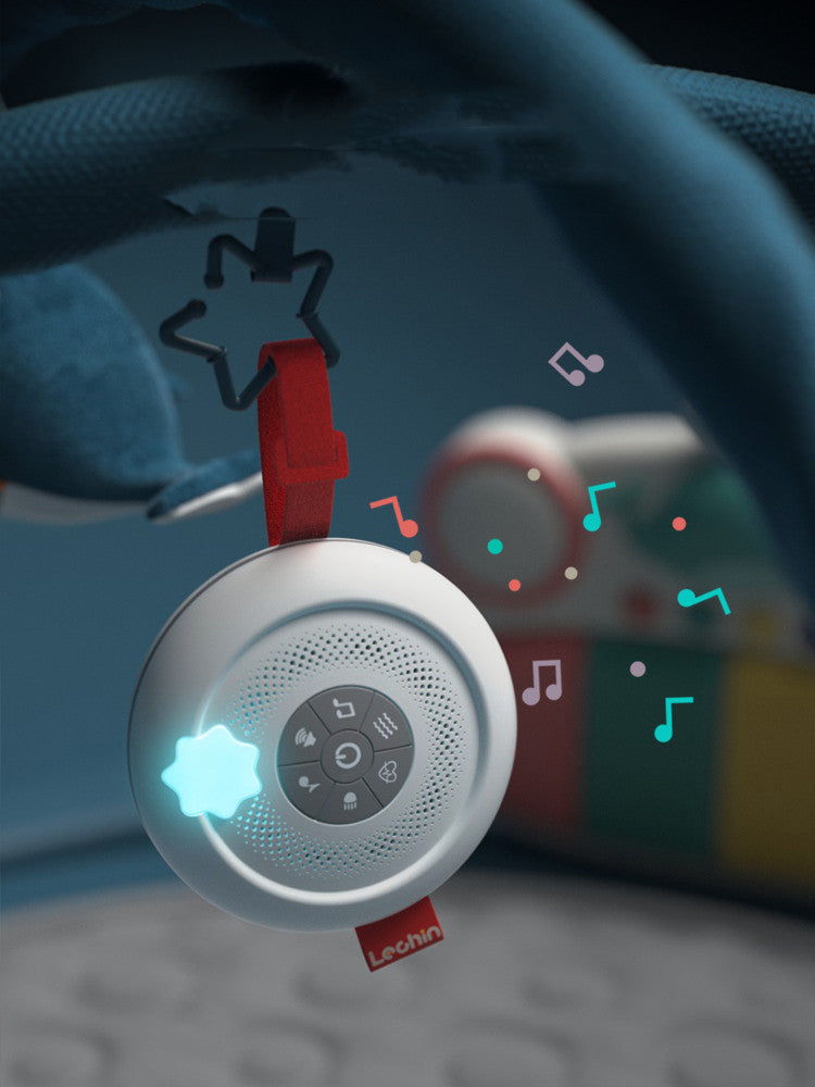 Levoit baby monitor with colorful star-shaped toy on a dark background