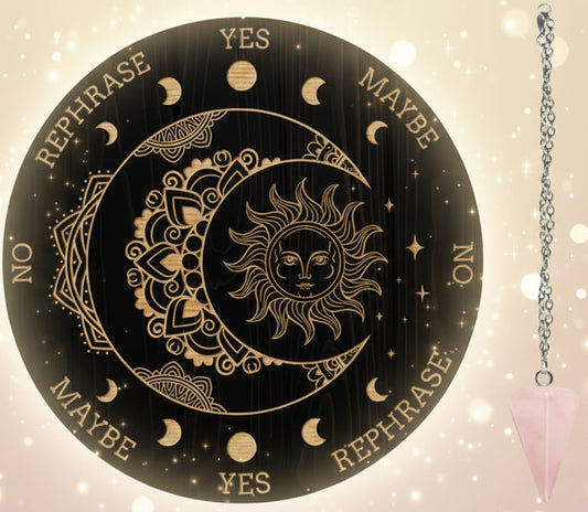 Decorative circular board with sun and moon design and a pink crystal pendulum on a white background