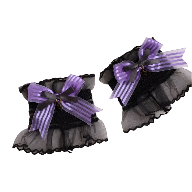 Black pet collars with purple ribbons on a white background