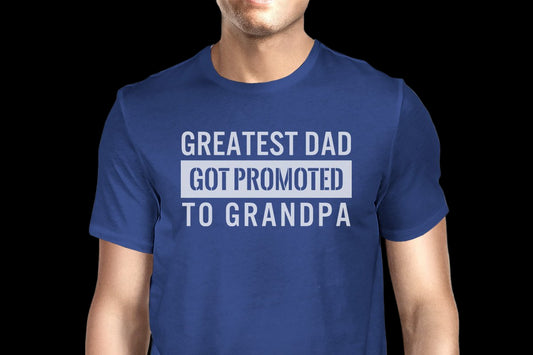 Blue t-shirt with text 'Greatest Dad Got Promoted to Grandpa' on a white background