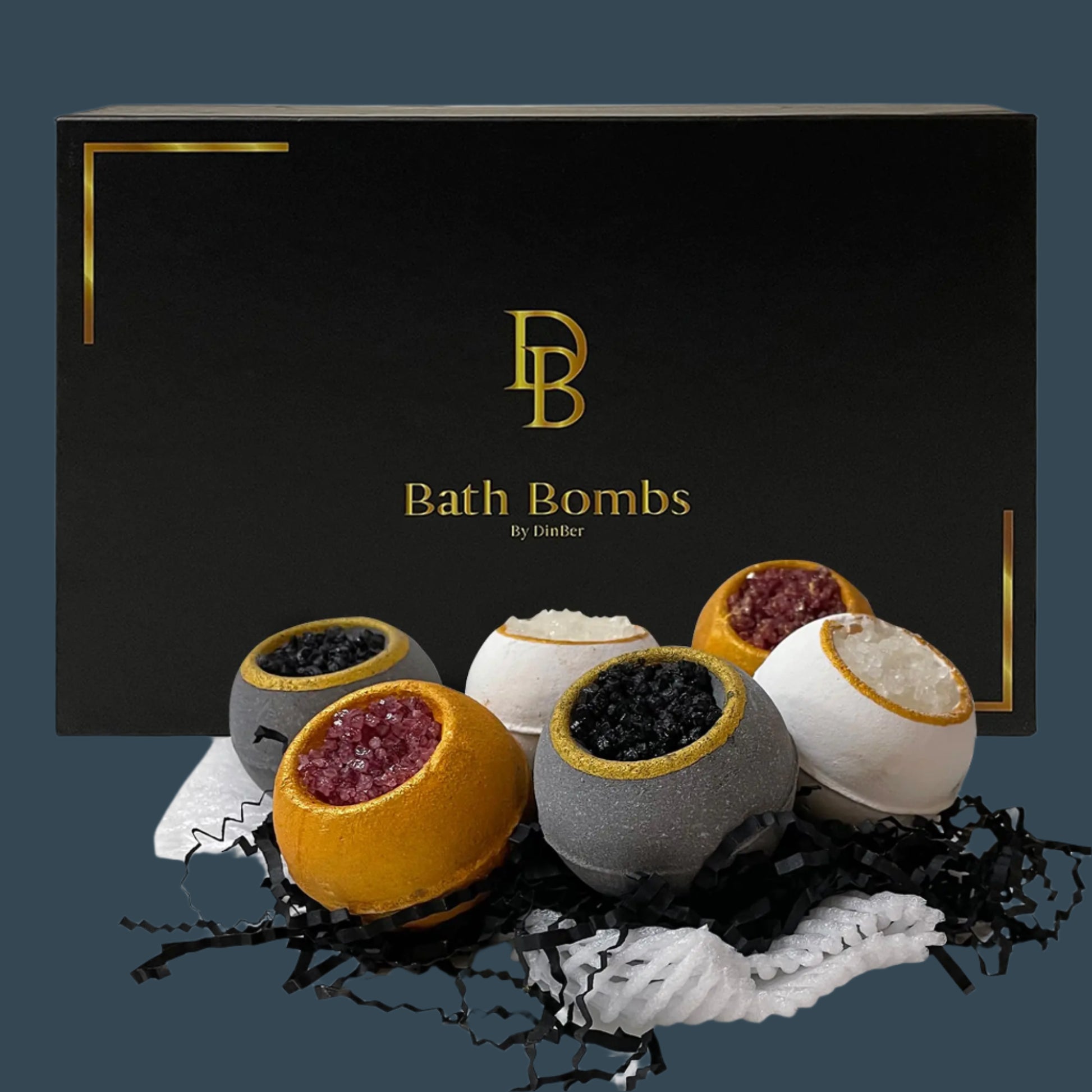 Set of bath bombs in front of a black box with 'DB Bath Bombs by Dindler' branding.