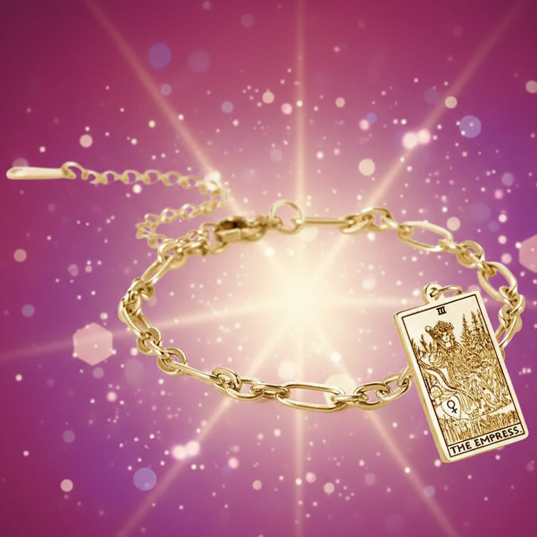Gold bracelet with 'The Empress' tarot card charm on a white background