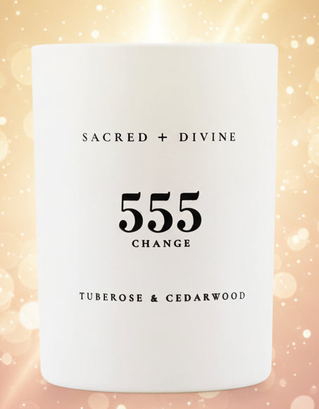 White candle with black text on a white background