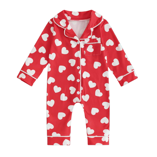 Red onesie with white heart pattern on a white background