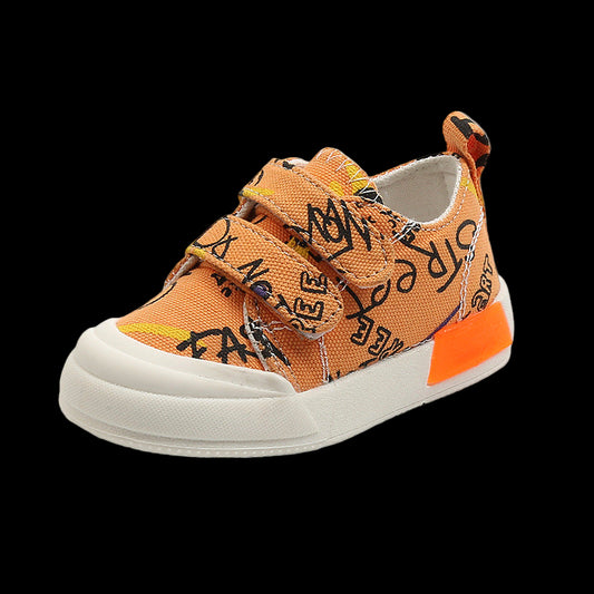 Orange children's sneaker with black text design on a white background