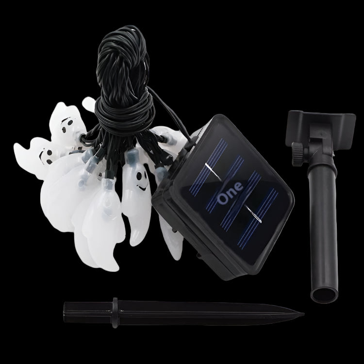 Halloween string lights with solar panel, remote, and stakes on a white background