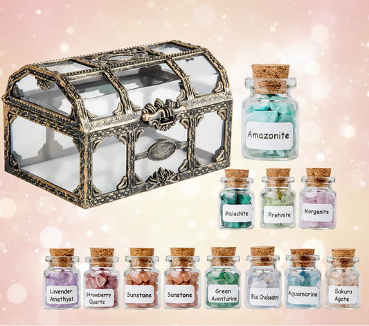 Decorative glass chest with small jars containing labeled gemstones on a white background