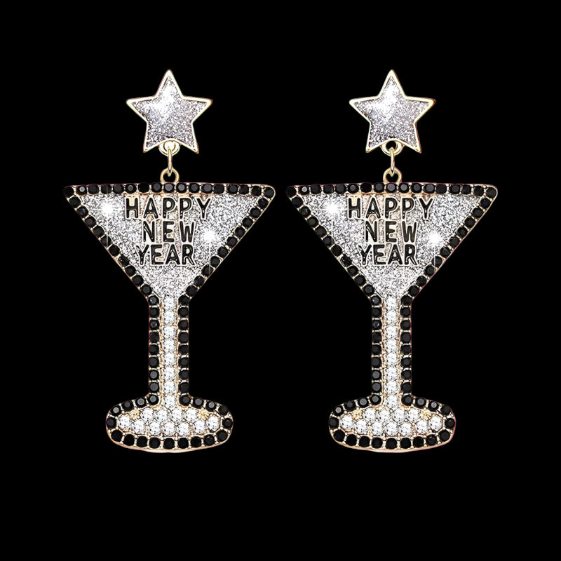 Earrings shaped like cocktail glasses with 'Happy New Year' text on a white background