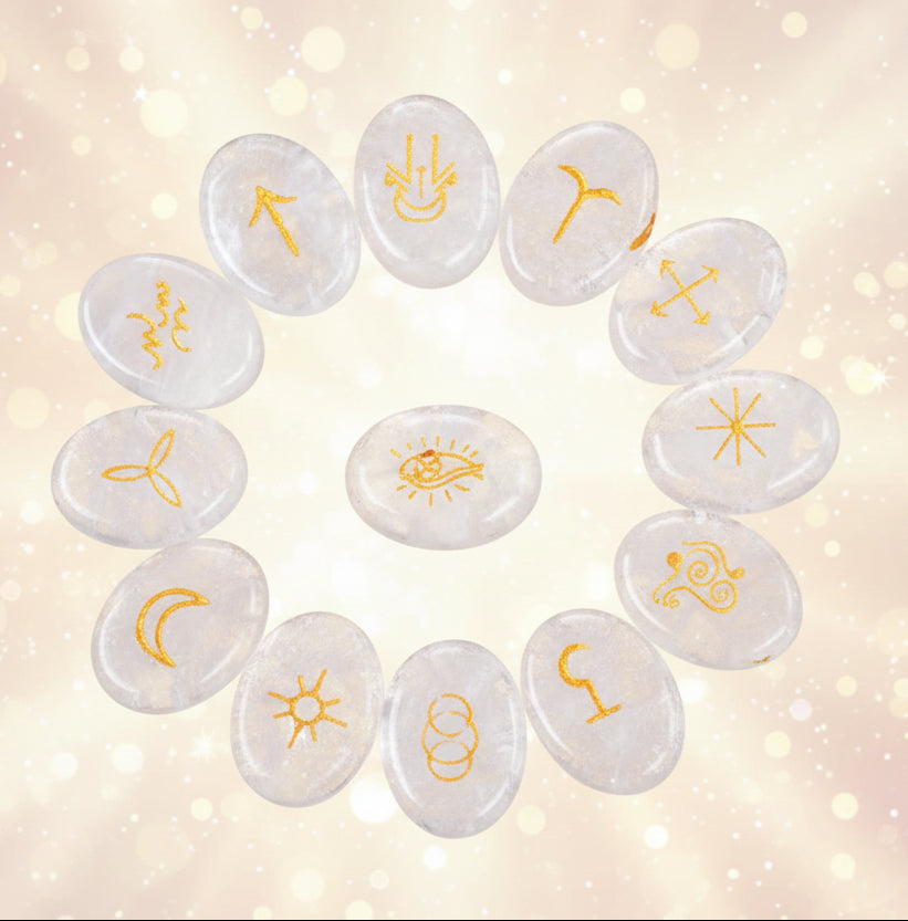 Set of stones with engraved zodiac symbols on a black background