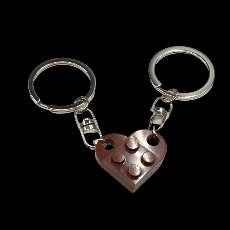 Heart-shaped keychain made of interlocking bricks on a white background
