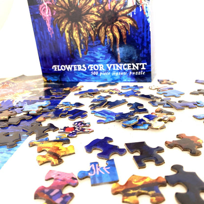 Jigsaw puzzle pieces with 'Flowers for Vincent' box in the background
