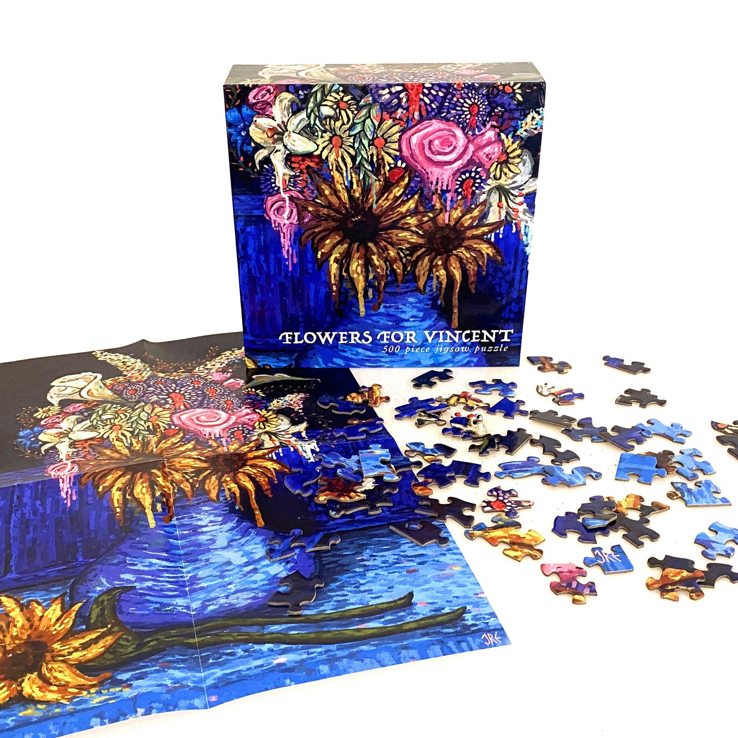 Flowers for Vincent puzzle set with packaging and scattered pieces on a white background