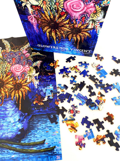Jigsaw puzzle set with 'Flowers for Vincent' artwork and scattered pieces on a white background